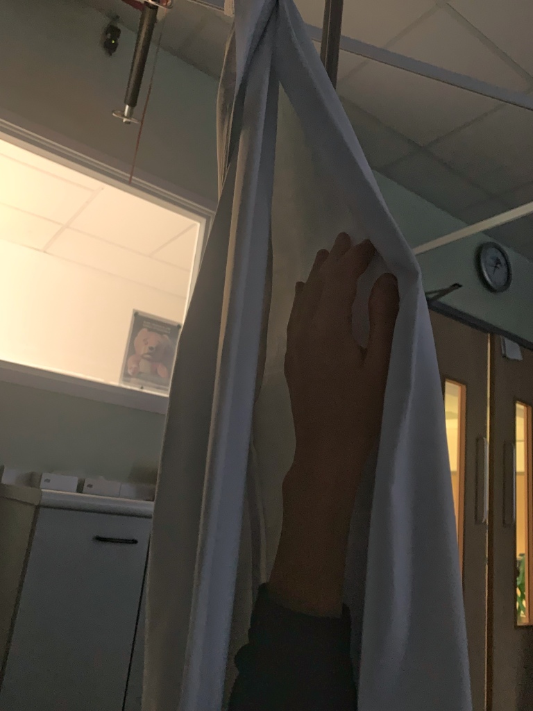 A pillow case used as a sling on a hospital ward to help keep an injured hand elevated